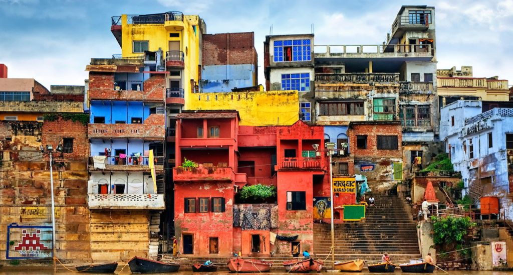 Chaotic colorful houses on the banks of river Ganges, Varanasi, India copy