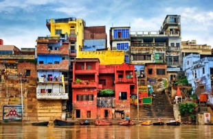Chaotic colorful houses on the banks of river Ganges, Varanasi, India copy
