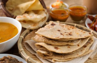 Jaipur | Chapati or Flat bread, roti canai, Indian food, made from wheat flour dough. Roti canai and curry. copy